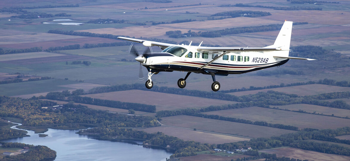 95West Cessna 208B Grand Caravan flying over the landscape that inspired the name and logo for the aerial mapping services company.