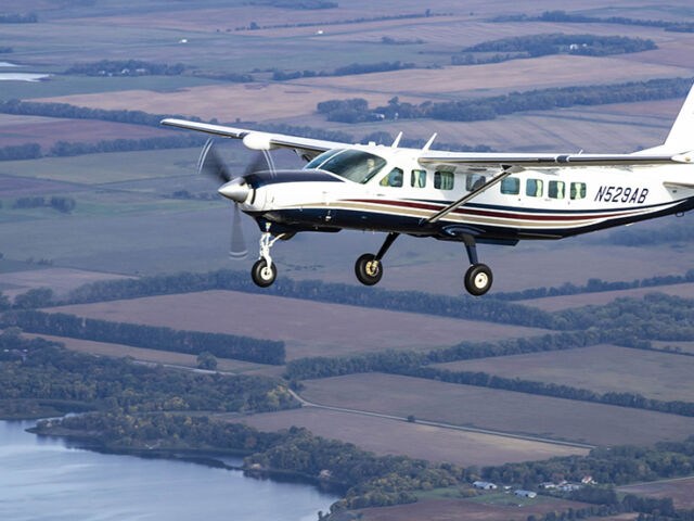 95West Cessna 208B Grand Caravan flying over the landscape that inspired the name and logo for the aerial mapping services company.