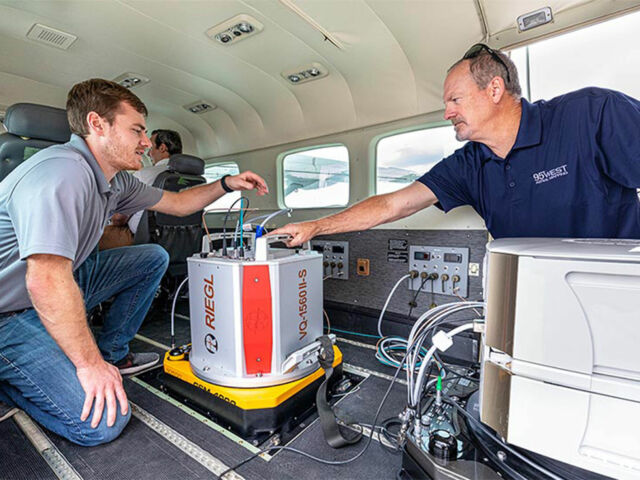 95West Pilot Andrew Werle (left) checks the RIEGL scanner with Aerial Services Manager Miles Strain (right) before takeoff.